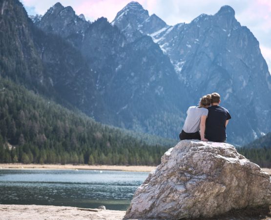 Couple sat on rock