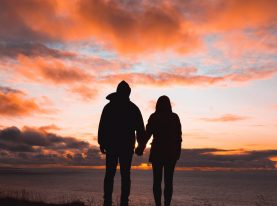 Couple holding hands